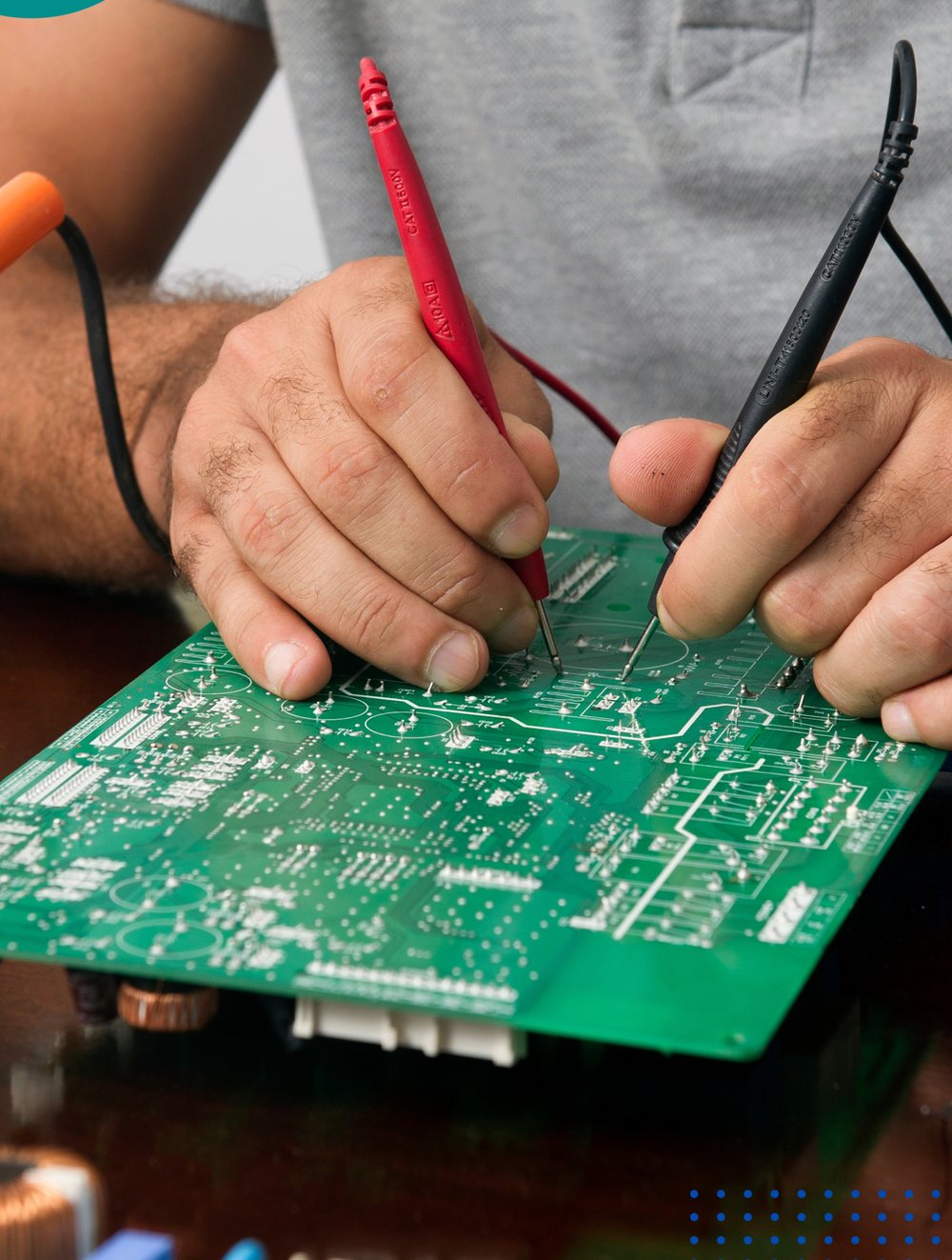 Prakash Technologies engineer servicing electronics on a workbench